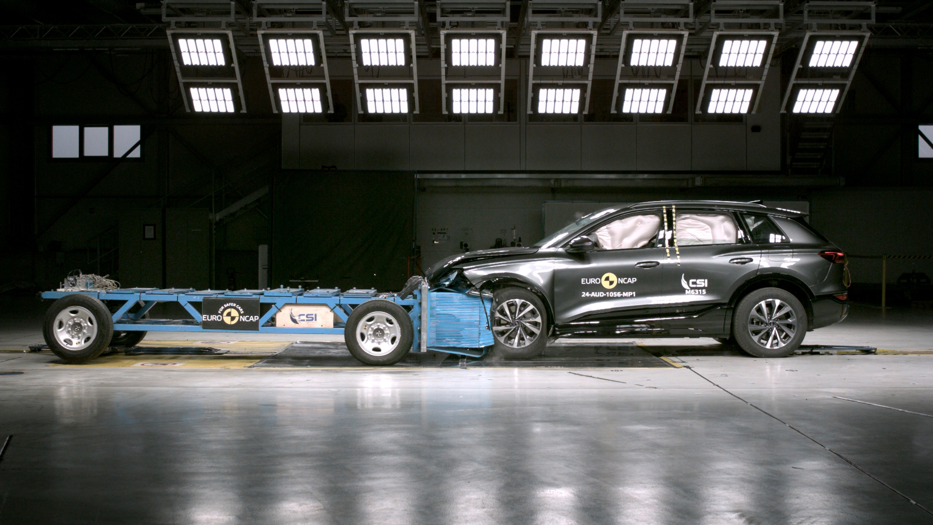 Black SUV undergoing a frontal crash test by Euro NCAP, showcasing safety evaluations with airbags deployed inside.