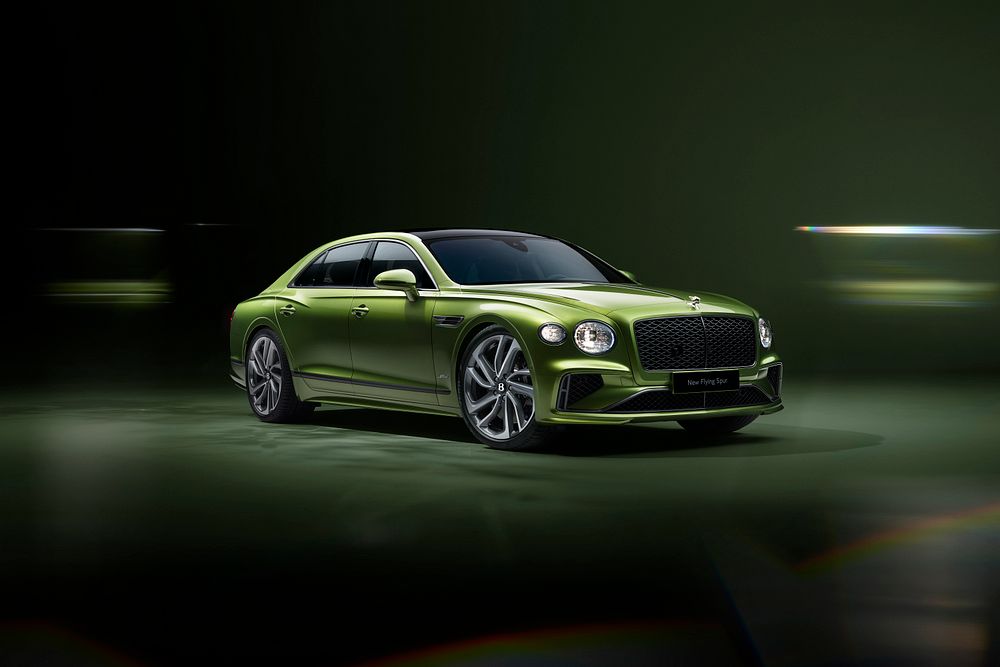 New Bentley Flying Spur Speed in a striking green finish, showcasing sleek luxury sedan design against a dark background.